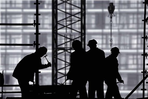 labourers-performing-work-on-construction-site